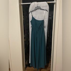 Floor length, a-line, chiffon dress. The color is peacock.